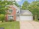Charming two-story home featuring a brick facade, attached two-car garage, and well-manicured lawn at 2576 Abbotts Glen Nw Dr, Acworth, GA 30101