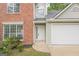 Charming two-story home featuring brick accents, a two-car garage, and a well-maintained front yard at 2576 Abbotts Glen Nw Dr, Acworth, GA 30101