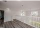 Hallway with hardwood floors, white railings, lots of natural light, and recessed lighting at 2576 Abbotts Glen Nw Dr, Acworth, GA 30101