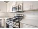 Close up on oven with stainless steel appliances and new white cabinets at 2576 Abbotts Glen Nw Dr, Acworth, GA 30101