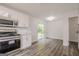 Open kitchen with stainless steel appliances, white cabinets, and plenty of counter space at 2576 Abbotts Glen Nw Dr, Acworth, GA 30101