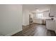Spacious kitchen with stainless steel appliances, white cabinets, and hardwood floors at 2576 Abbotts Glen Nw Dr, Acworth, GA 30101