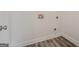 Laundry room featuring hookups, gray wood-look floors and white trim at 2576 Abbotts Glen Nw Dr, Acworth, GA 30101