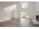 Spacious living room with high ceilings, fireplace, hardwood floors and plenty of natural light at 2576 Abbotts Glen Nw Dr, Acworth, GA 30101