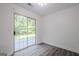 Bright room with sliding door and gray wood-look floors; ample natural light and neutral colors at 2576 Abbotts Glen Nw Dr, Acworth, GA 30101