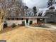 Charming single-story home with a brick facade, well-maintained front yard, and a convenient covered carport at 1068 Longshore Dr, Decatur, GA 30032
