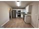 Updated kitchen featuring stainless steel appliances, granite countertops and white cabinets at 1068 Longshore Dr, Decatur, GA 30032