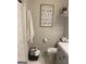 Cozy bathroom with a modern vanity, decorative wall art, and a shower-tub combination at 517 Pebble Pt, Loganville, GA 30052