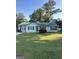 Charming single-story home featuring a green metal roof and well-maintained lawn at 517 Pebble Pt, Loganville, GA 30052