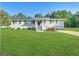 Charming single-story home with a well-manicured lawn, inviting front porch, and freshly painted trim at 64 Gregory Ct, Dallas, GA 30157