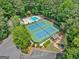 Aerial shot of community amenities including pool, tennis courts, playground, parking, and lush greenery at 335 S Satinwood Pl, Roswell, GA 30076