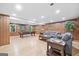 Spacious finished basement with pool table, seating area, and natural light at 335 S Satinwood Pl, Roswell, GA 30076