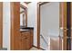 Classic bathroom with a wooden vanity and a black countertop; perfect for guests at 335 S Satinwood Pl, Roswell, GA 30076