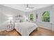 Comfortable bedroom with decorative lighting and white walls at 335 S Satinwood Pl, Roswell, GA 30076