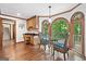 Cozy breakfast nook with custom woodwork, natural light, and a view of the surrounding trees at 335 S Satinwood Pl, Roswell, GA 30076