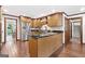 Spacious kitchen featuring custom cabinetry, stainless steel appliances, and a central island at 335 S Satinwood Pl, Roswell, GA 30076
