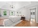 This main bedroom features lots of light, wood floors, and neutral colors at 335 S Satinwood Pl, Roswell, GA 30076