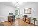 Bright office with hardwood floors, built-in desk and decorative map at 335 S Satinwood Pl, Roswell, GA 30076