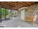 Covered patio with a bench, brick columns, and a view of the yard at 335 S Satinwood Pl, Roswell, GA 30076