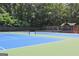 Community tennis courts for active recreation, featuring well-maintained courts, nets, and seating at 335 S Satinwood Pl, Roswell, GA 30076