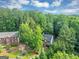 Aerial view of a home with lush green surroundings, offering privacy and natural beauty at 1625 Clark Lake Nw, Acworth, GA 30102
