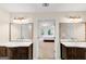 Bathroom featuring double vanity sinks with decorative mirrors at 1625 Clark Lake Nw, Acworth, GA 30102