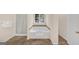 Bathroom with soaking tub and tiled floor at 1625 Clark Lake Nw, Acworth, GA 30102