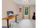Bedroom with desk and guitar, filled with natural light and a ceiling fan at 1625 Clark Lake Nw, Acworth, GA 30102
