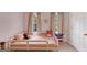 Bright bedroom featuring a bed with floral patterned curtains and large windows at 1625 Clark Lake Nw, Acworth, GA 30102