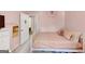 Charming bedroom featuring light pink walls, a bed, and dresser at 1625 Clark Lake Nw, Acworth, GA 30102