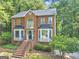 Charming two-story brick home with beautiful windows, black shutters and a landscaped front yard at 1625 Clark Lake Nw, Acworth, GA 30102
