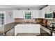 Open kitchen with granite countertops and stainless appliances at 1625 Clark Lake Nw, Acworth, GA 30102