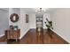 Living room featuring hardwood floors, decorative wall art and modern light fixture at 1625 Clark Lake Nw, Acworth, GA 30102