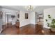 Open-concept living room with hardwood floors and modern lighting at 1625 Clark Lake Nw, Acworth, GA 30102