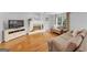 Cozy living room with fireplace, comfortable seating, and hardwood floors for a warm atmosphere at 1625 Clark Lake Nw, Acworth, GA 30102
