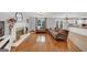 Open-concept living area with fireplace, hardwood floors, and seamless flow to the kitchen at 1625 Clark Lake Nw, Acworth, GA 30102