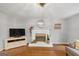 Cozy living room features a fireplace and hardwood floors at 1625 Clark Lake Nw, Acworth, GA 30102
