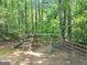 Backyard playground featuring a slide, swings, and climbing structure for ' entertainment at 1625 Clark Lake Nw, Acworth, GA 30102