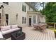 Back deck with patio furniture with view of house, deck has cream exterior and dark trim at 155 Carrolls Way, Fayetteville, GA 30215