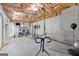 Unfinished basement with concrete walls and insulation, ready for customization and home gym equipment at 155 Carrolls Way, Fayetteville, GA 30215