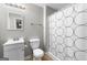 Bathroom with tiled floors, standard toilet, vanity, and shower with patterned curtain at 155 Carrolls Way, Fayetteville, GA 30215