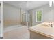 Bathroom featuring double sink vanity, a soaking tub, and glass enclosed shower at 155 Carrolls Way, Fayetteville, GA 30215