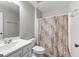 Bathroom featuring a shower and a sink with white cabinets at 155 Carrolls Way, Fayetteville, GA 30215