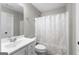 Bathroom featuring a shower and a sink with white cabinets at 155 Carrolls Way, Fayetteville, GA 30215