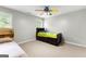 Bedroom featuring neutral carpet, twin beds, ceiling fan, and window at 155 Carrolls Way, Fayetteville, GA 30215