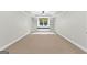 Well lit bedroom with a ceiling fan, closet, and carpeted flooring at 155 Carrolls Way, Fayetteville, GA 30215