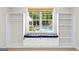 Comfortable bedroom window seat with built in shelves, drawers, and a clear view of the backyard pool at 155 Carrolls Way, Fayetteville, GA 30215
