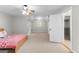 A bedroom with neutral walls and carpet with access to attic storage at 155 Carrolls Way, Fayetteville, GA 30215