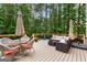 Spacious deck with outdoor seating, dining table, and stylish wicker furniture, perfect for entertaining at 155 Carrolls Way, Fayetteville, GA 30215