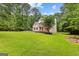 Two-story home on a large lot with a manicured lawn and mature trees at 155 Carrolls Way, Fayetteville, GA 30215